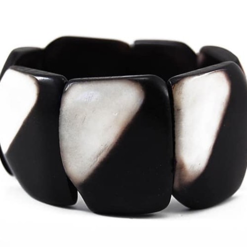 A black and white bracelet made from tagua, this bracelet can stretch.