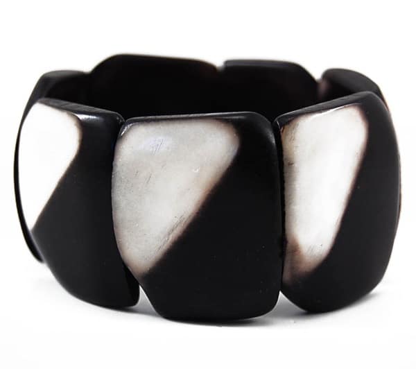A black and white bracelet made from tagua, this bracelet can stretch.