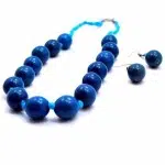 A detailed picture of the blue cotton and pearl set.
