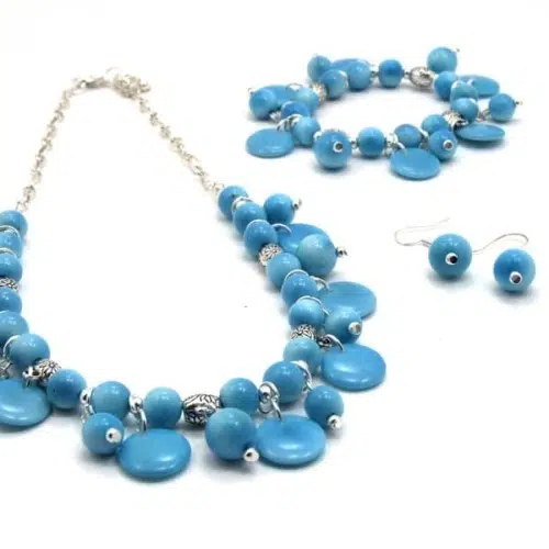 A picture of the bloom set, this set is made from tagua, shaped into flower petals, with alpaca silver accents.