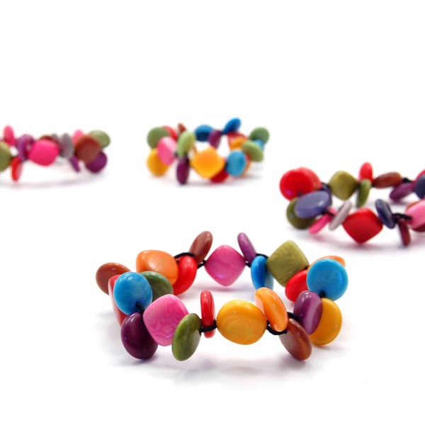 Brightly colored tagua circles, diamonds, and squares. all on an elastic bracelet.
