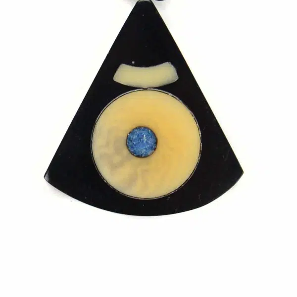 A picture of the triangle reconstituted tagua set made from tagua dust.