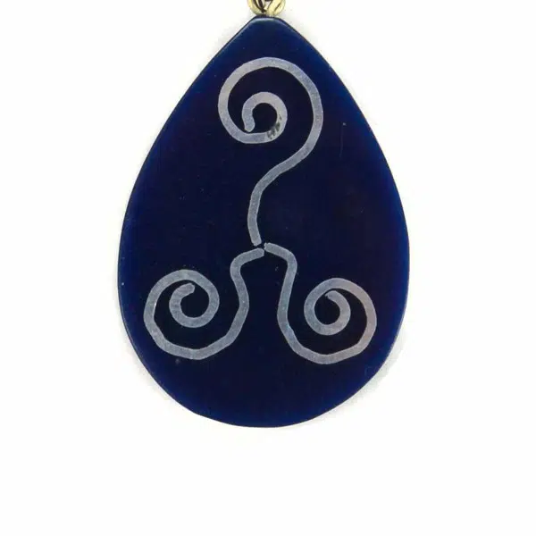 A picture of the reconstituted tagua set, made from tagua dust. This one is colored blue with some wind like design on.