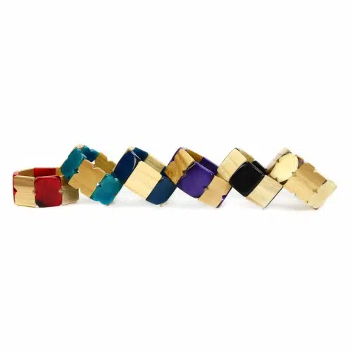 Tagua and teak bracelet, comes in a verity of colors, those colors are, red, turquoise, blue, purple, black, and wood.