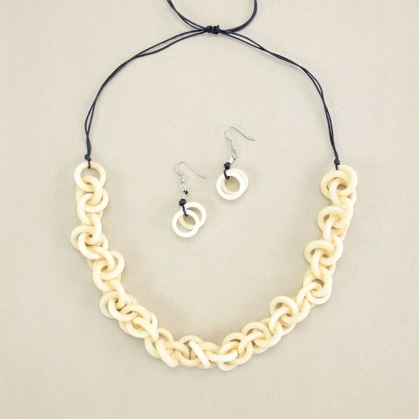 A picture of the white heliz set made from tagua links in a very chic tagua chain.