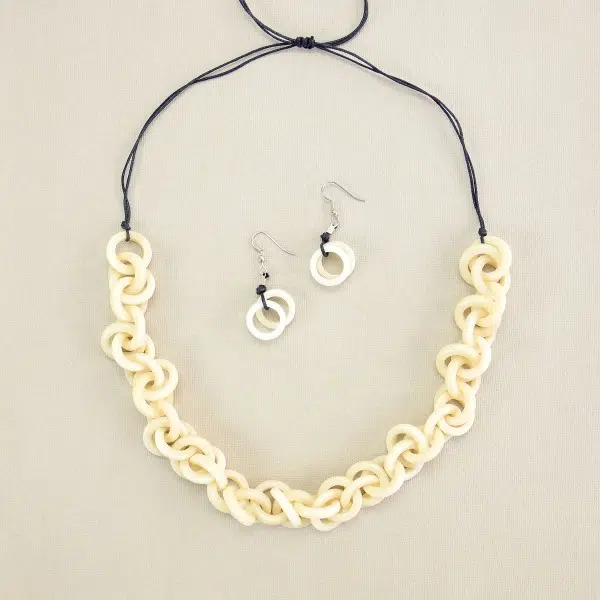 A picture of the white heliz set made from tagua links in a very chic tagua chain.