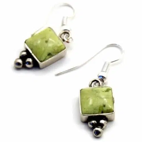 Two earrings, with stone shapes attached to them, the color of this square is green.
