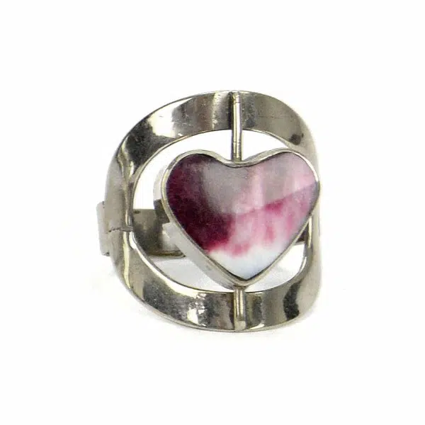 A close up picture of the heart shaped flip stone ring.