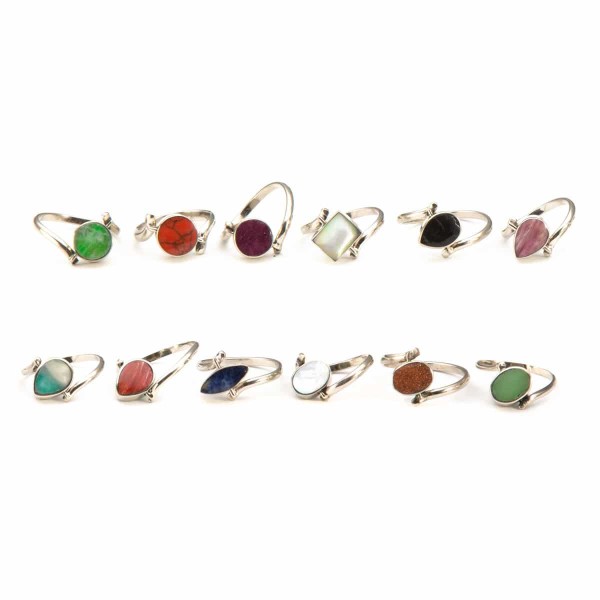 A picture of all the different colors that the mini flip stone ring, the colors in this picture are, green, red, purple, white, black, pink, turquoise, blue, and brown.