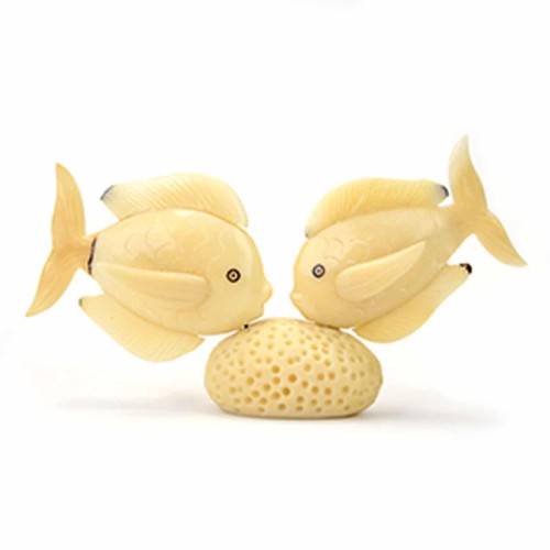 Two fish looking at each other on top of a coral, made from tagua seeds.