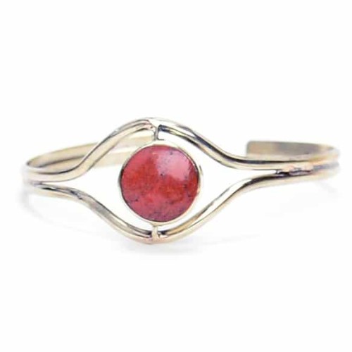 A flip stone cuff that has a polished stone that flips over to reveal another another color.