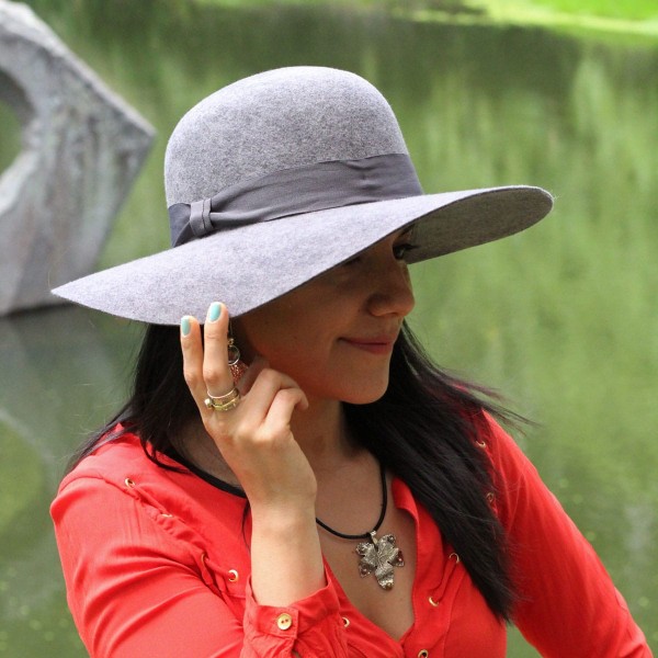 young women wearing the wool zoe hat, the color of the hat she is wearing is grey