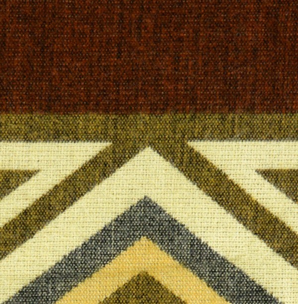 A close up of the comodo poncho, showing colors and designs, this one is brown with green