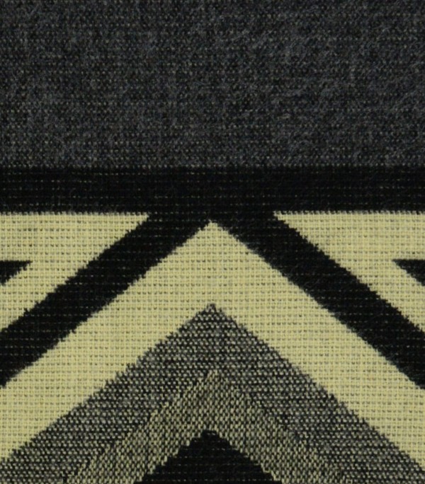 A close up of the comodo poncho, showing colors and designs, this one is Grey, black, and white