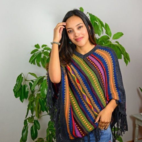 A young women wearing aurora alpaca poncho available in several colors