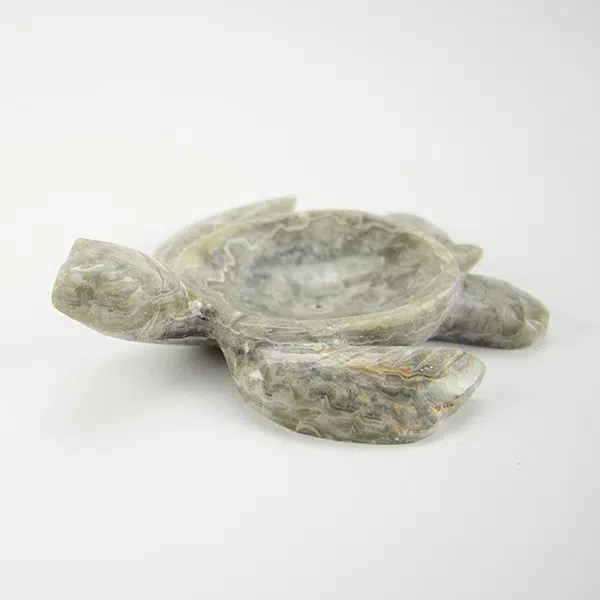 A close up of the marble soap dish, in the color grey