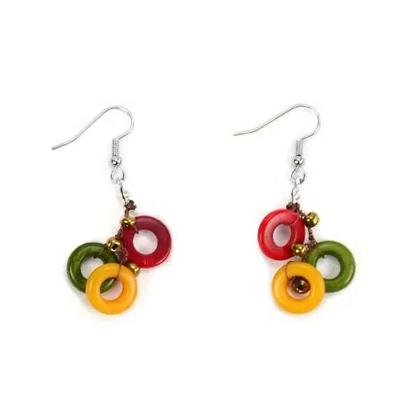 A set of the melody earrings, there rings are red, green, and yellow.