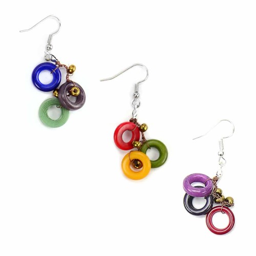 A picture of three melody earrings, showing the bright colorful carved tagua rings.