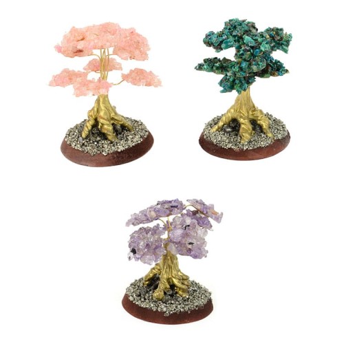 three golden trees all with different colored leafs, the three colors in this picture are pink, chrysocolla, and purple