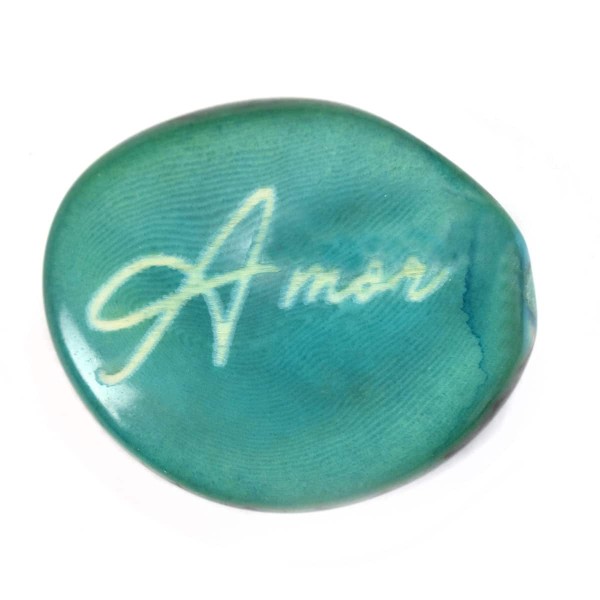 A tagua seed that says amen on it
