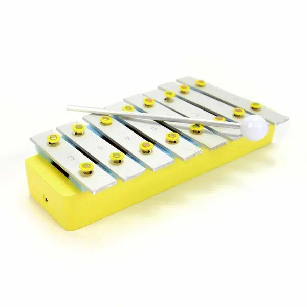A close up of the yellow xylophone
