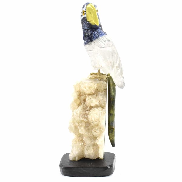 a parrot sitting on a semi precious stone parrot, the colors of the stones are, white.