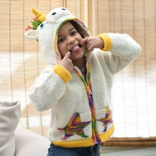 Kid wearing the unicorn animal sweater
