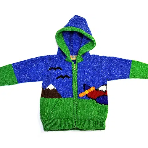 Airplane sweater with a mountain scene and an airplane flying around