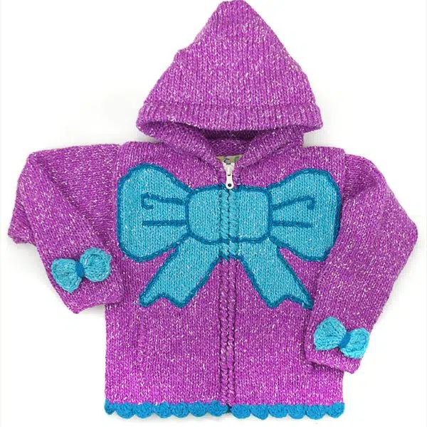 A purple and blue sweater with a big bow in the middle and two small bows on the sides