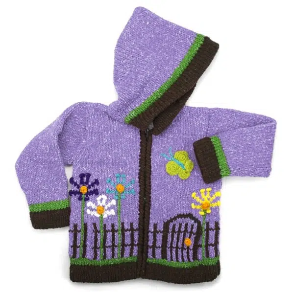 A sweater that has a idyllic garden scene, comes in the color purple.