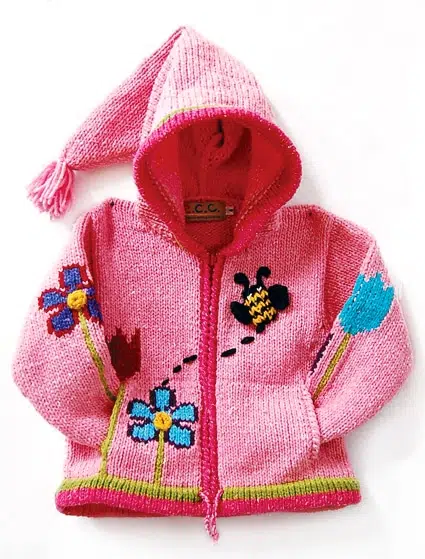 a hand made sweater with a three- dimensional bee, flying around, can zip-up, comes in more than one color, this color is pink