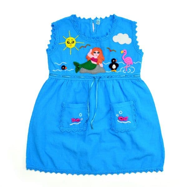 A blue dress with some designs applied onto it, the dress is 100% cotton