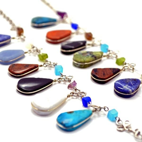 A wide verity of multi teardrop stone necklaces, has a semi precious stone.