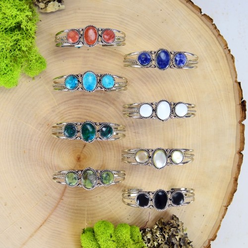 A picture showing all of the different colors that the triple stone cuffs can come in.