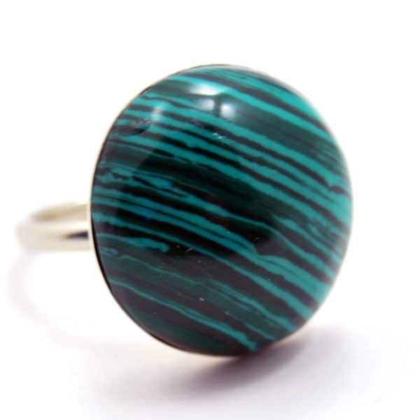 A close up picture of the dome ring, the semi precious stone is turquoise and black kk