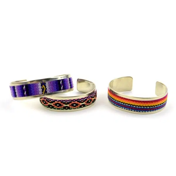 Three different colored textile cuff, those colors are, purple, multi, and black/purple.