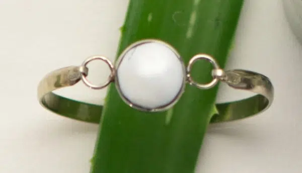 A close up picture of the semi-precious top latch bracelet, a close up picture of the white.