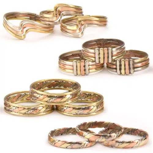 A wide verity of different three metal rings.
