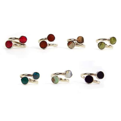 A picture of a bunch of different colors for the mini twin stone rings, the colors in this picture are, red, dark red, brown, green, turquoise, white, and black.