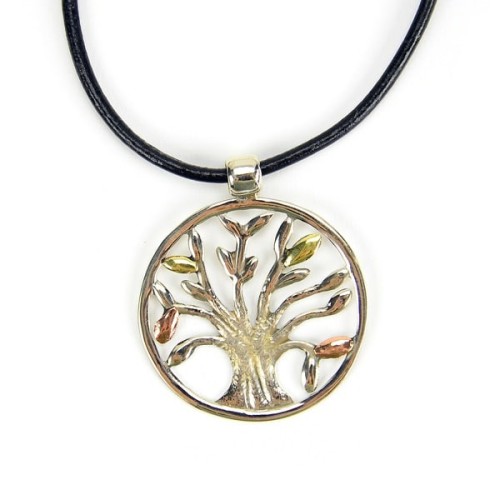 A picture of the vida necklace, featuring a tree in the middle made from brass, copper, and alpaca silver.