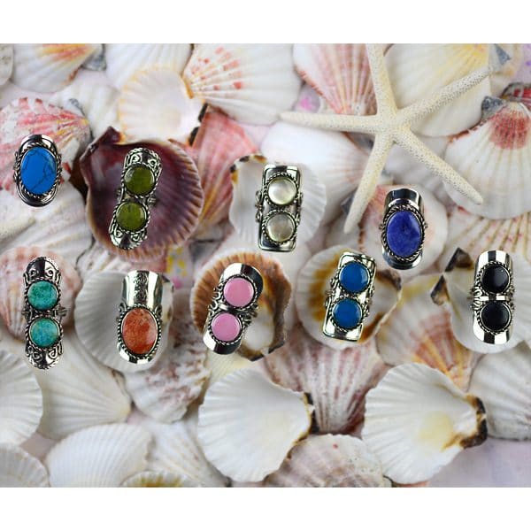 A picture of 8 different earth stone rings.