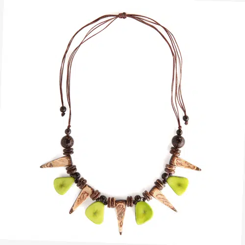 A picture of a necklace made from thick slices of tagua and made from coconut beads.