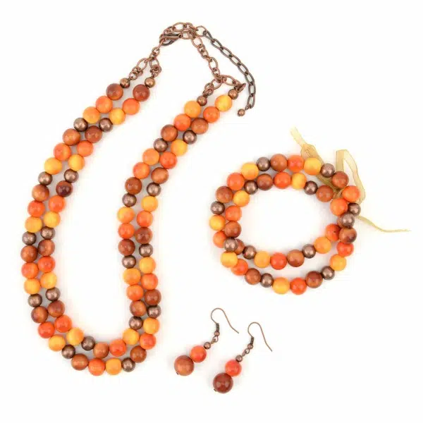 A picture of the orange peapod set, showing the necklace, bracelet, and earrings.