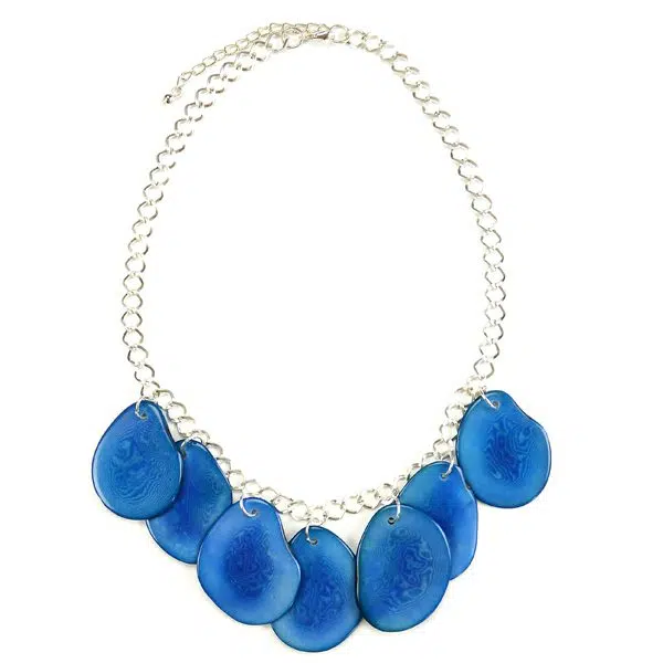 Slices of brightly dyed tagua, connected to a chain, the color of the tagua slices is blue.