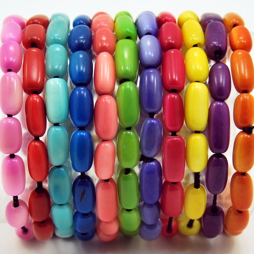 A close up picture of the arroz bracelet spring and summer colors, those colors are, pink red, turquoise, blue, green, light purple, dark pink, yellow, purple and orange