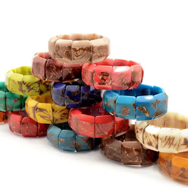 The chiseled bracelet is made from tagua, also comes in a verity of colors those colors are, red, orange, yellow, yellow/green, green, turquoise, blue, purple, pink, white, black.