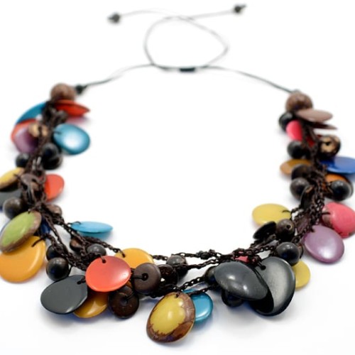 A picture of the storm necklace, comes with a verity pf tagua, coconut, and acai drops on the necklace.
