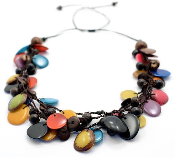 A picture of the storm necklace, comes with a verity pf tagua, coconut, and acai drops on the necklace.