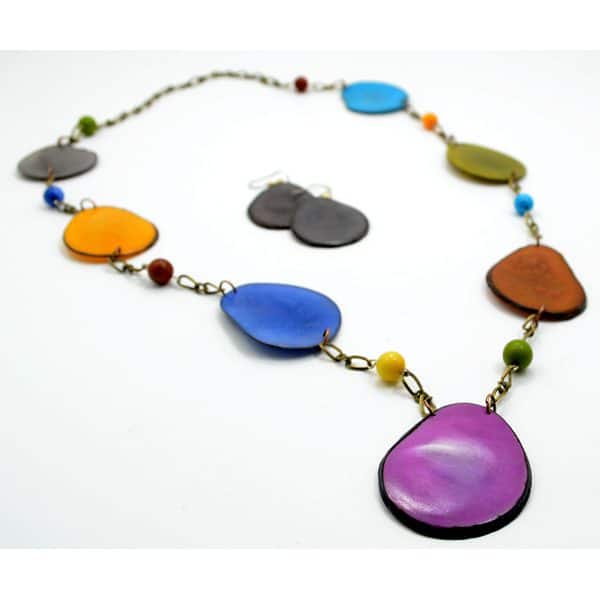 The fettered set, made with tagua slices on a bronze toned chain. the color of the necklace is multi.