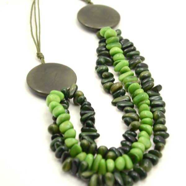 A picture of the green and black tagua smile necklace.
